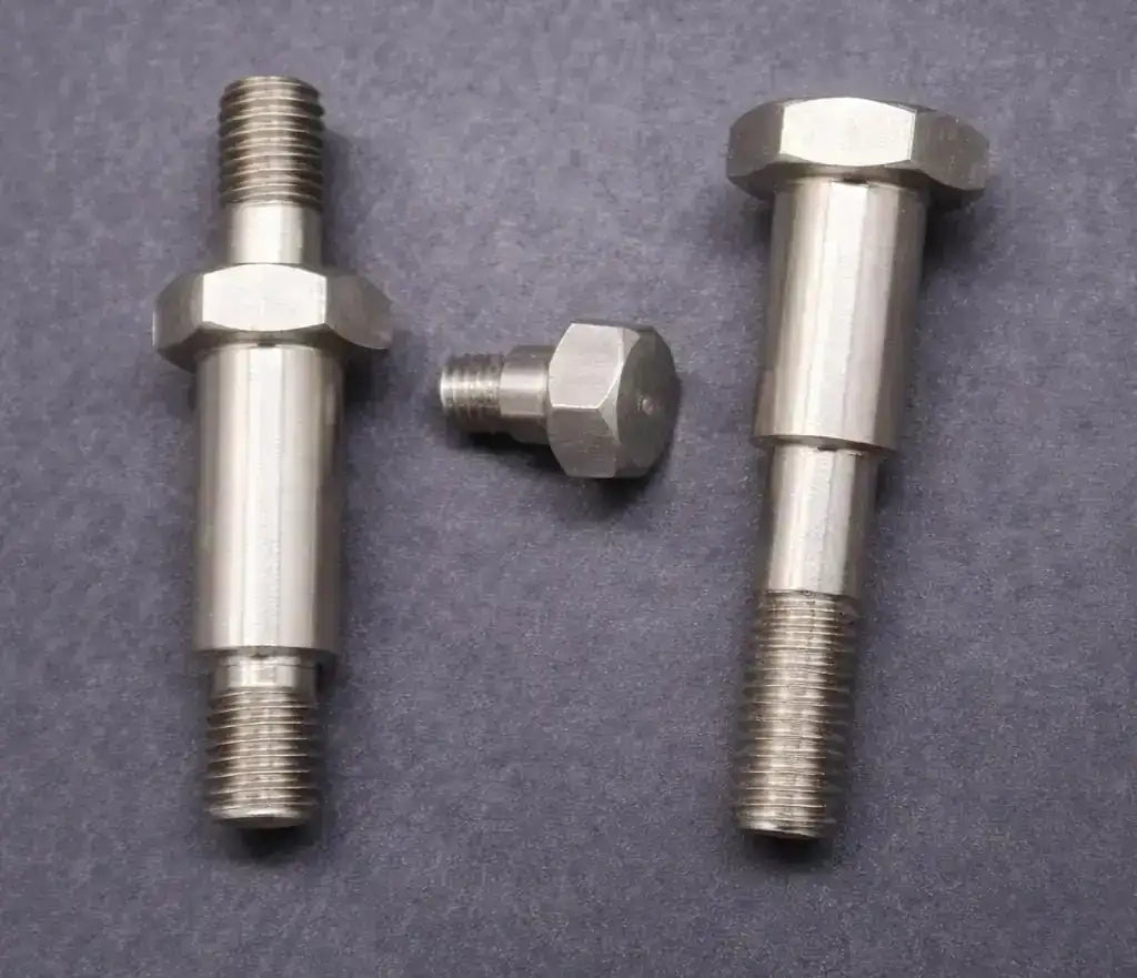 Precision-machined step screw and double-end stud for industrial clamping applications.