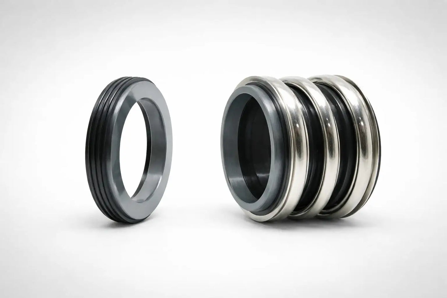 Bellows cartridge seal mechanical seal components with stationary seat and multi-part cartridge assembly on a light grey background.