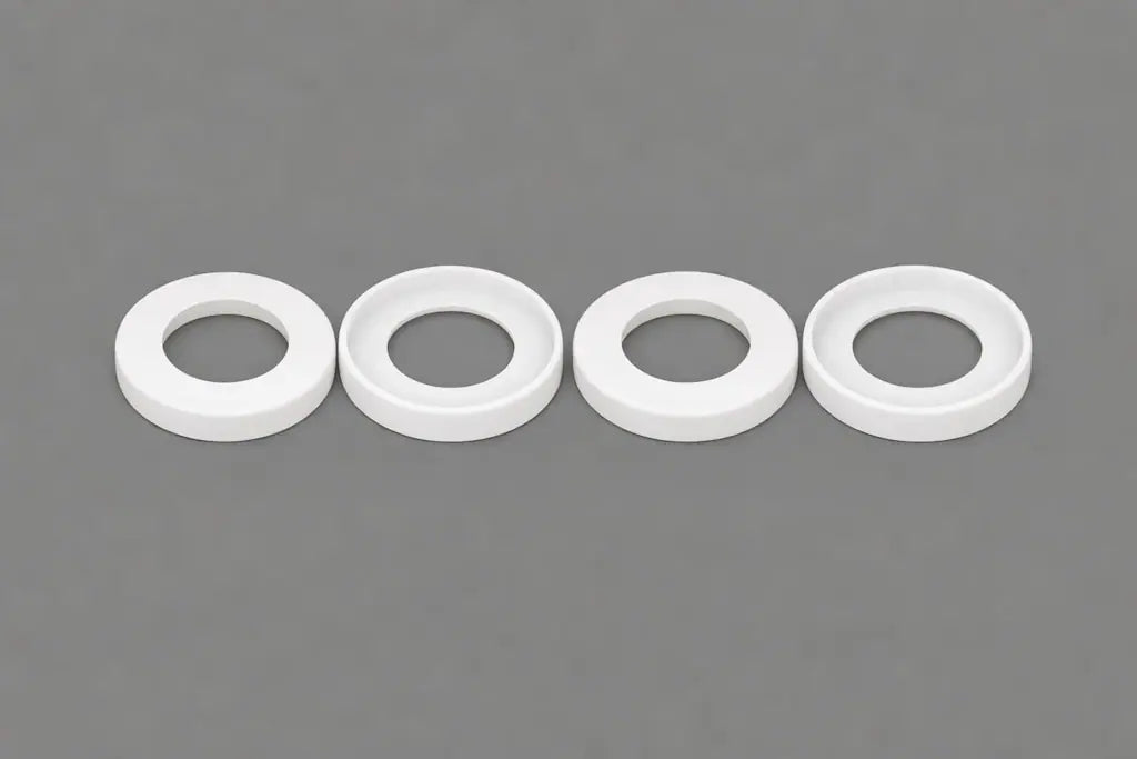 White plastic cup seals (U-cup style) for hydraulic and pneumatic cylinders, machined by Kaybin for rod and piston sealing in industrial OEM applications.