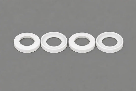 White plastic cup seals (U-cup style) for hydraulic and pneumatic cylinders, machined by Kaybin for rod and piston sealing in industrial OEM applications.