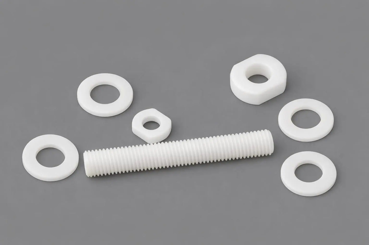 Plastic nuts, washers and threaded rod machined by Kaybin from engineering polymers for corrosion-resistant industrial fastening across South Africa and Africa.
