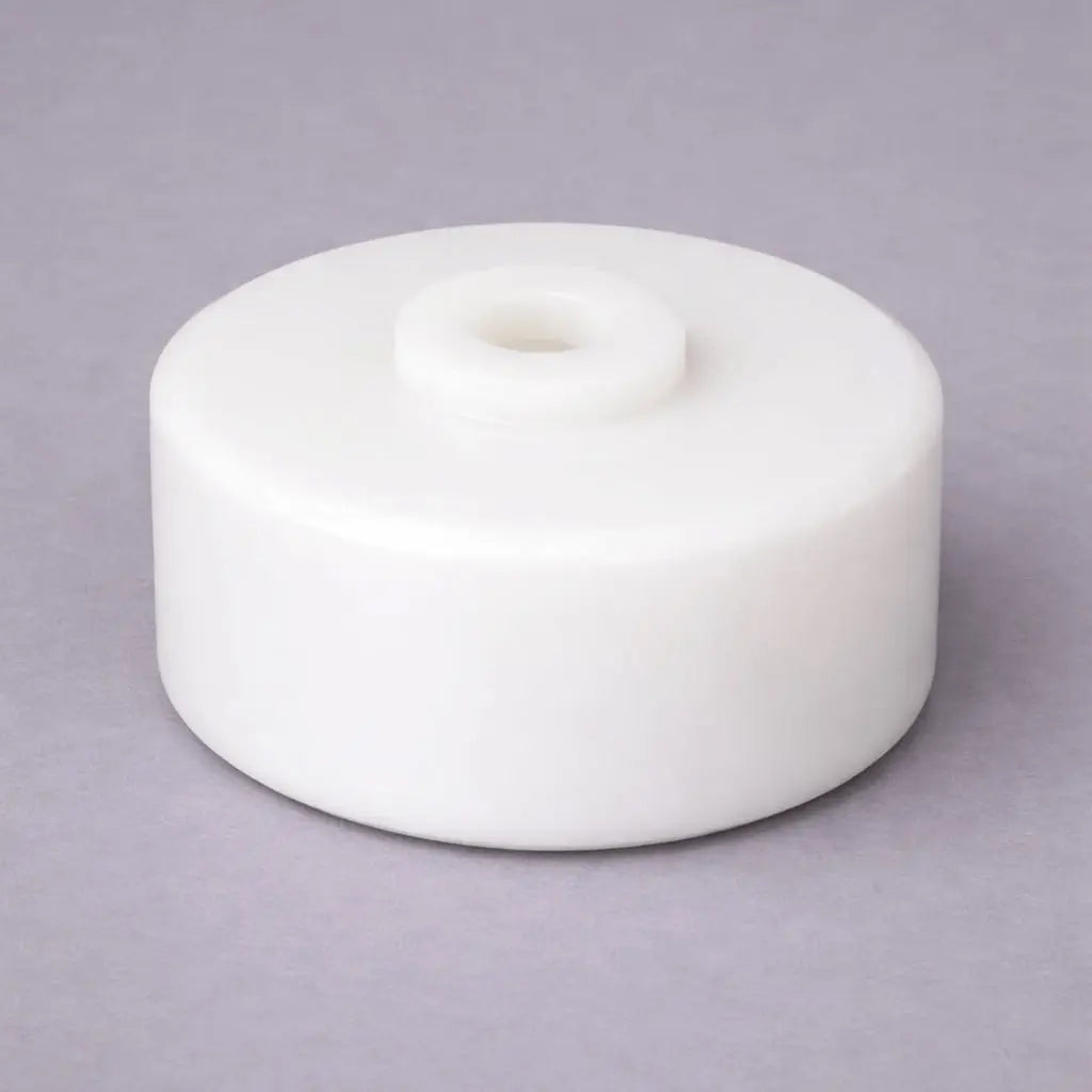 Industrial plastic conveyor wheel with precision-machined hub bore for material handling and trolley systems, manufactured by Kaybin.