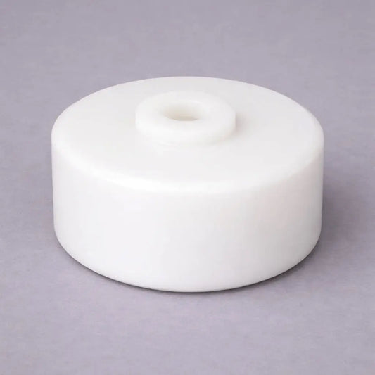 Industrial plastic conveyor wheel with precision-machined hub bore for material handling and trolley systems, manufactured by Kaybin.