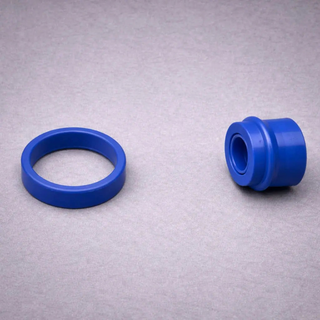High-pressure blue polyurethane piston seal and rod seal with matching wiper seal for hydraulic and pneumatic cylinder applications.